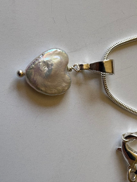 Pendant: Heart shaped freshwater pearl pendant on silver bail