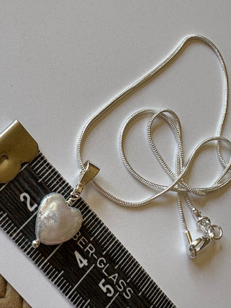 Pendant: Heart shaped freshwater pearl pendant on silver bail