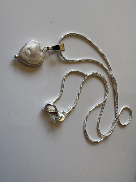 Pendant: Heart shaped freshwater pearl pendant on silver bail