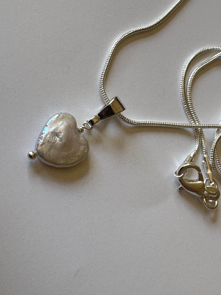 Pendant: Heart shaped freshwater pearl pendant on silver bail