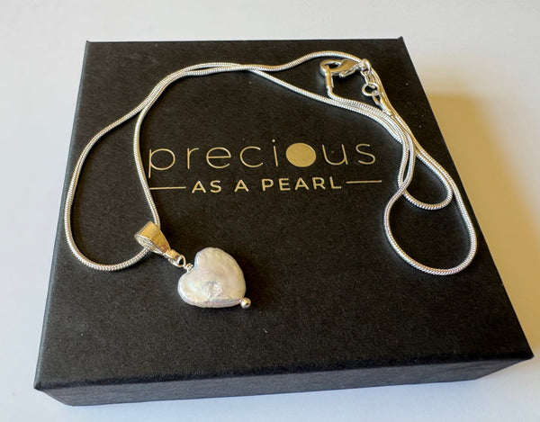 Pendant: Heart shaped freshwater pearl pendant on silver bail