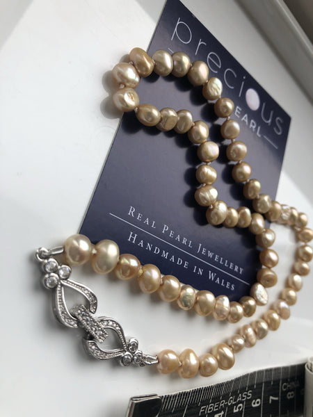 Necklace: ‘gold' pearls handknotted on silk thread with hearts and flowers clasp - Classic - Precious as a Pearl