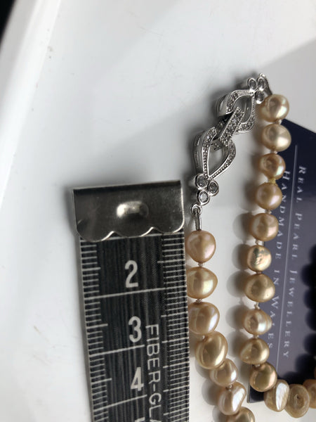 Necklace: ‘gold' pearls handknotted on silk thread with hearts and flowers clasp - Classic - Precious as a Pearl