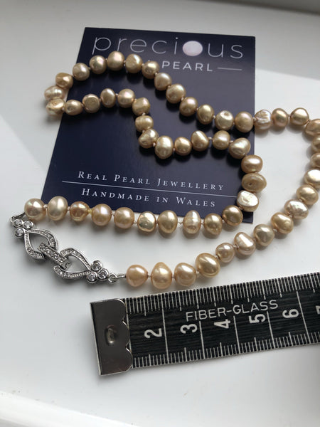 Necklace: ‘gold' pearls handknotted on silk thread with hearts and flowers clasp - Classic - Precious as a Pearl