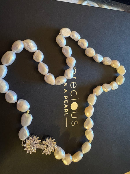 Necklace: Dainty freshwater pearl necklace with a pink hue