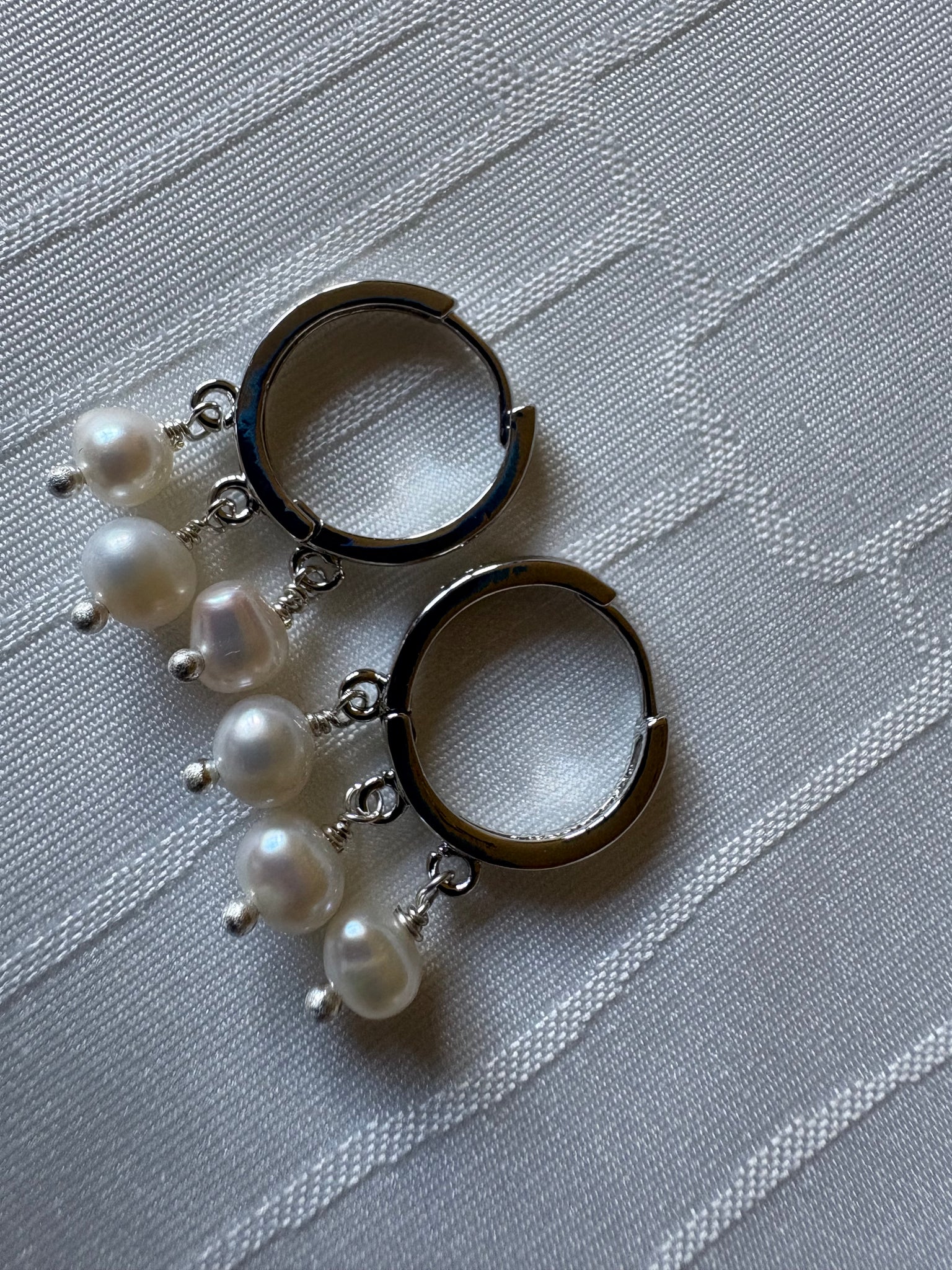 Earrings: Silver hoops with ivory freshwater pearls