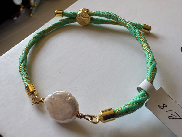 Bracelet: Pearl coin corded slider bracelets in goldtone.