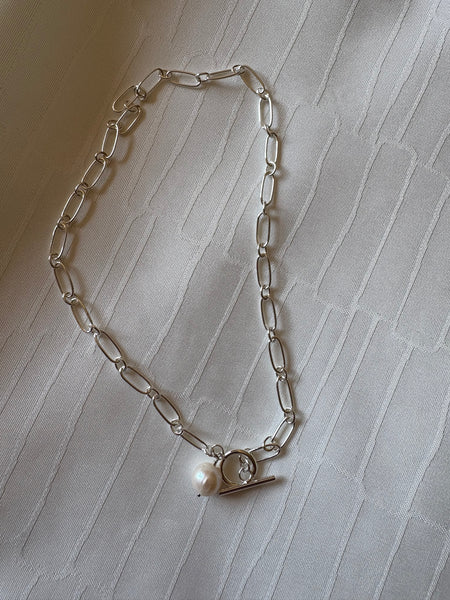 Necklace: Large freshwater pearl on a silver link chain with a toggle clasp