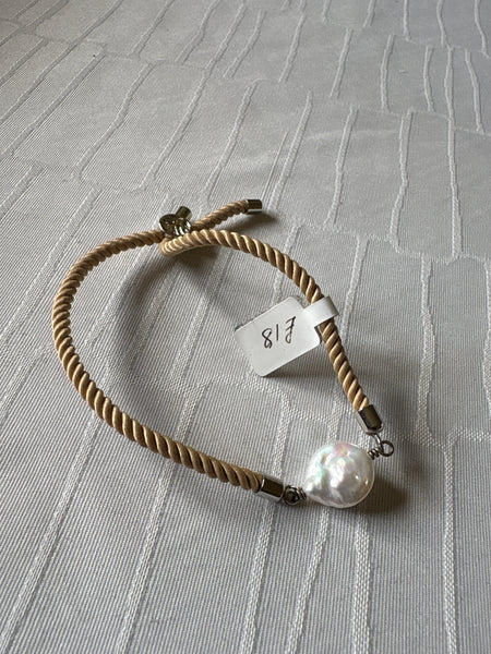 Bracelet: Pearl coin slider cord bracelets in silvertone.