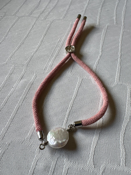 Bracelet: Pearl coin slider cord bracelets in silvertone.