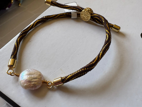 Bracelet: Pearl coin corded slider bracelets in goldtone.