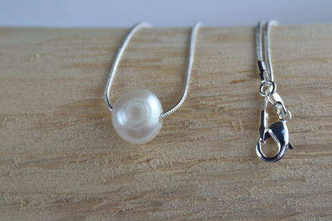 Pendant: Floating ivory pearl on silver snake chain - classic collection - Precious as a Pearl