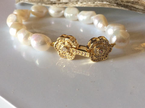 Bracelet: baroque ivory pearl with pretty gold finish flower clasp - classic gold tone - Precious as a Pearl