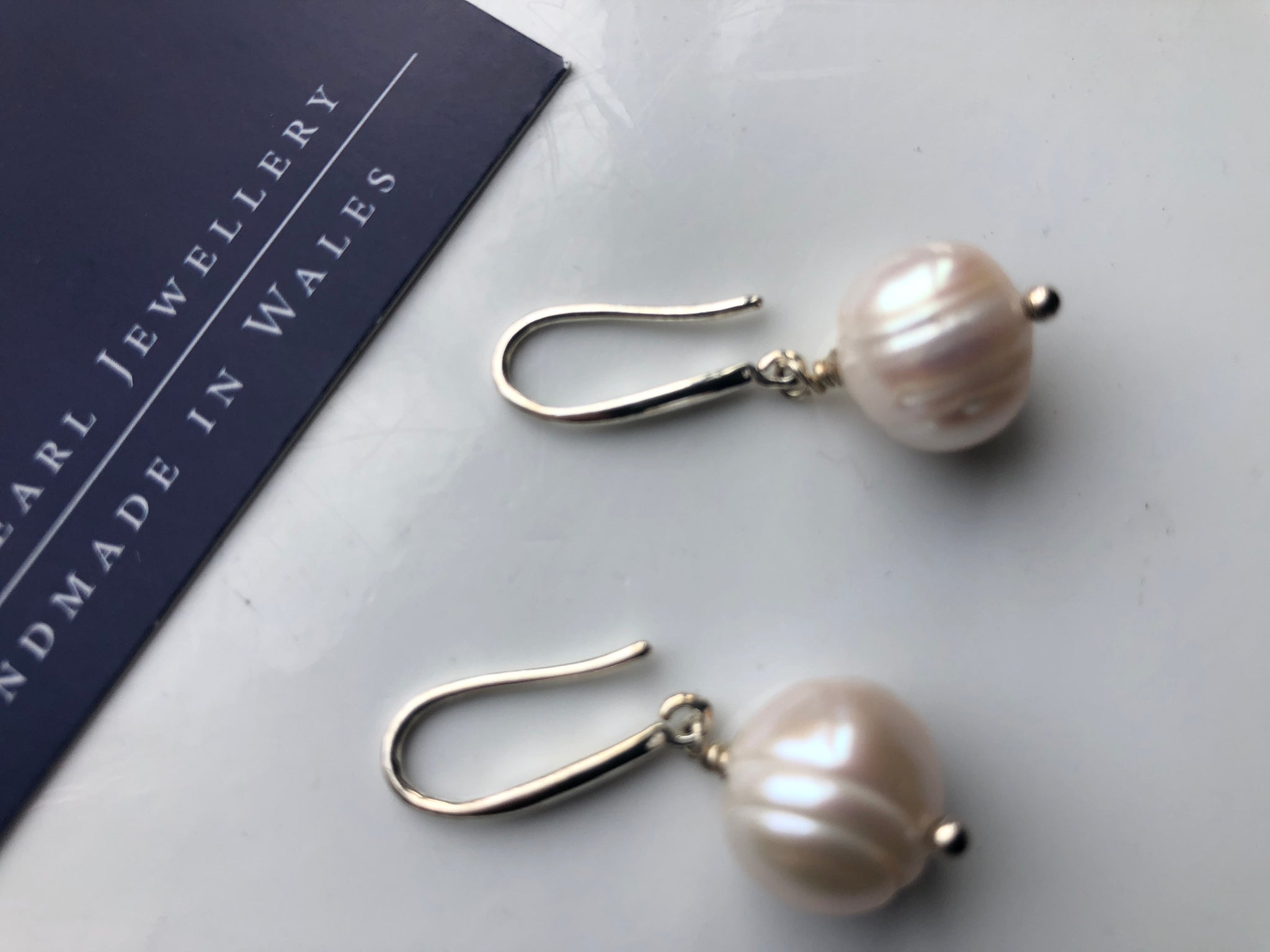 Earrings: Large single ivory pearl drop earrings - classic