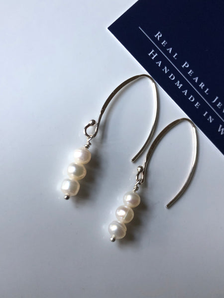 Earrings: Long triple drop Pearl ivory earrings on flat side hooks