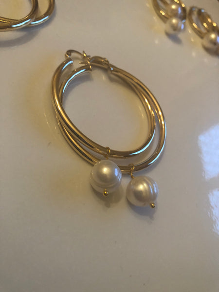 Earrings: Large gold plated  hoops with large ivory pearl