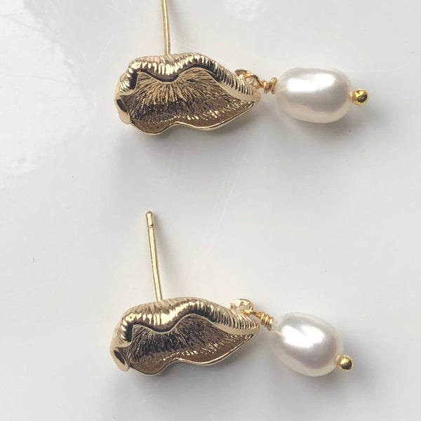 Earrings: Ivory freshwater pearl teardrop on gold-plated leaf post