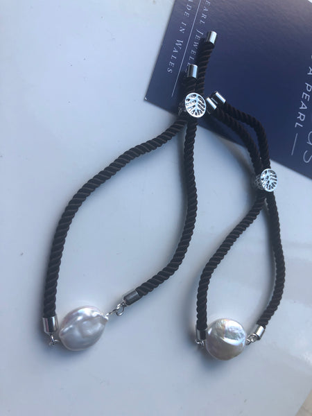 Bracelet: Pearl coin slider cord bracelets in silvertone.