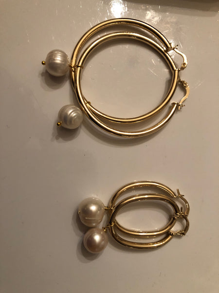 Earrings: Large gold plated  hoops with large ivory pearl